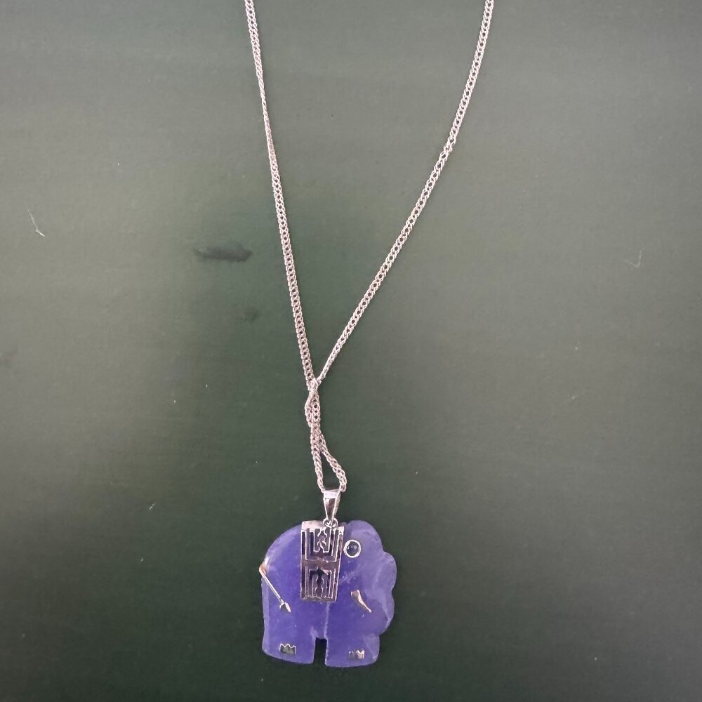 Purple jade elephant pendant on a silver chain